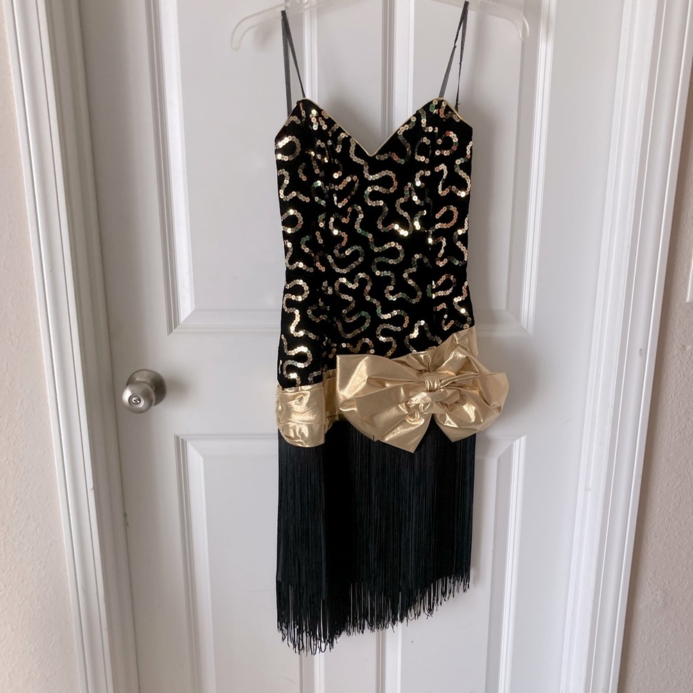Black Cocktail Dress with Gold Sequin, and fringe and satin on the bottom.